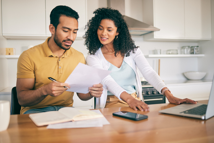 A couple evaluating their tax deduction options.