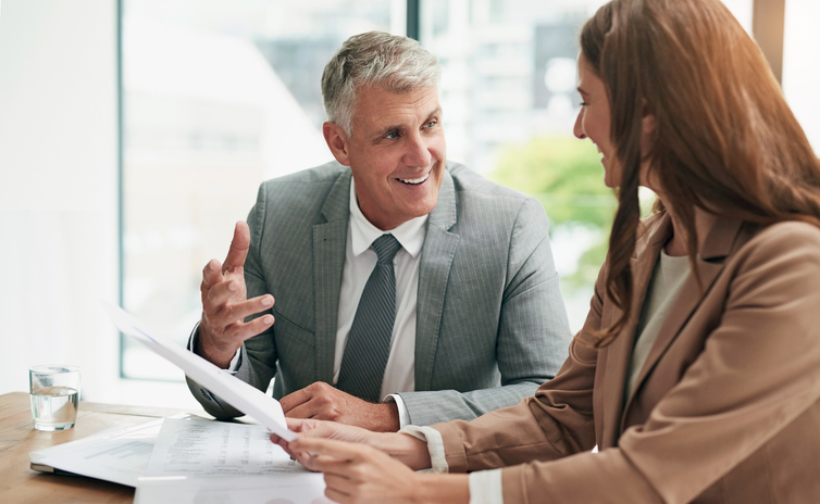 A financial advisor discussing a retirement plan strategy with a client.