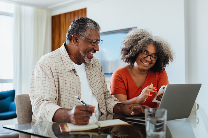 A senior couple reviewing their retirement plan.